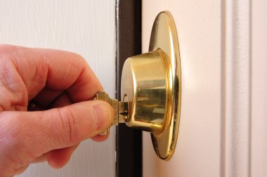 Locking a Dead Bolt clipart