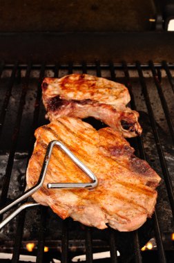 A Pork Chop on the grill clipart