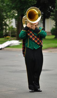 Performer Playing Marching Tuba clipart