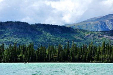 Canoeing on Spirit Lake, Yukon Territory clipart