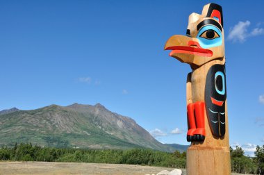 Eagle Totem Pole Against a Blue Sky clipart