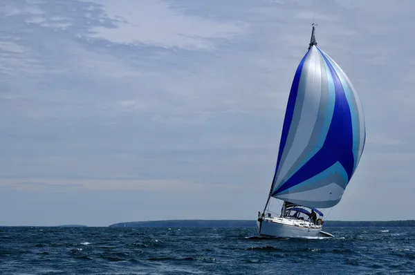 Sailboat with Blue Spinnaker Sail — Stock Photo, Image