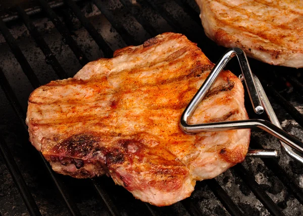 A Pork Chop on the grill — Stock Photo, Image