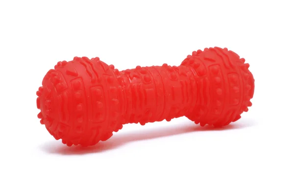 Κόκκινο πλαστικό squeaky σκυλί μασώ παιχνίδι — Φωτογραφία Αρχείου
