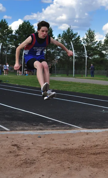 Teen Boy doing the Triple Jump — Stock Photo, Image