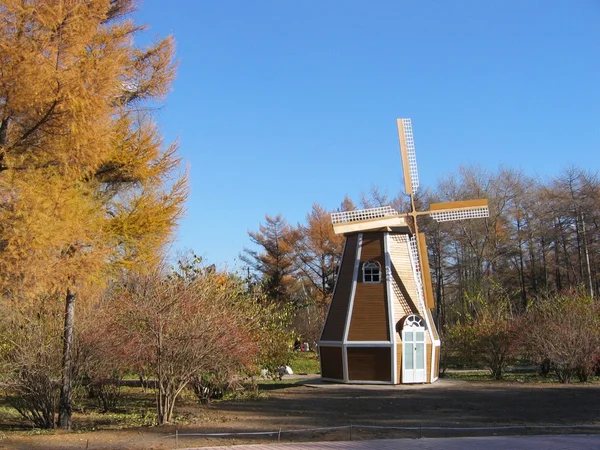 Windmill, autumn park scenery — Stock Photo, Image