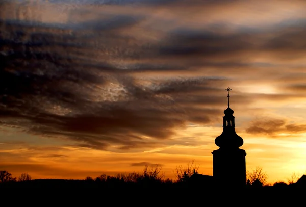 stock image Sunset over the church tower