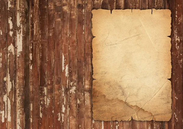 stock image Old wrinkled paper on wood