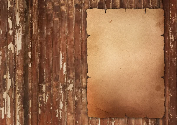 Old wrinkled paper on wood — Stock Photo, Image