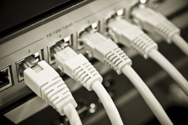 Network cables connected to switch clipart