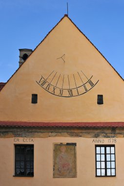 Sundial on the wall old building clipart