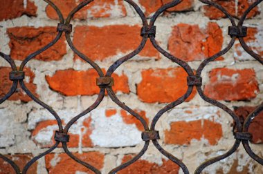 Pattern of iron grid and brickwall backg clipart