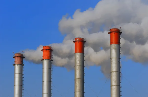 stock image Four factory chimneys