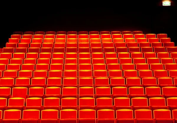 stock image Empty rows of red theatre seats