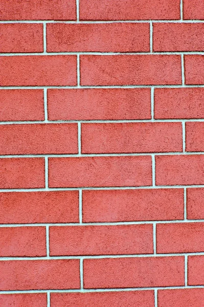 Красная кирпичная стена в качестве фона — стоковое фото