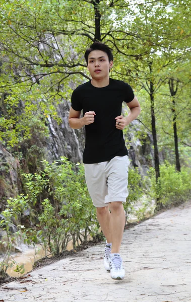 Giovane uomo Jogging — Foto Stock