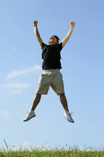 College student jumping — Stockfoto