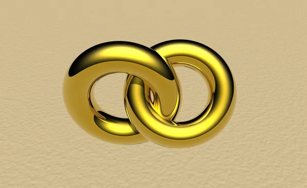 Zwei Ringe auf braunem Sand — Stockfoto