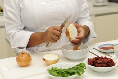 Happy chef cutting onions clipart