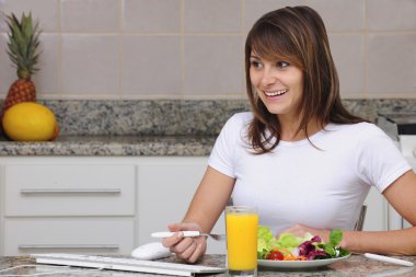 Woman eating a salad clipart