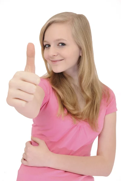 Tonårsflicka gestikulerande tummen upp tecken — Stockfoto