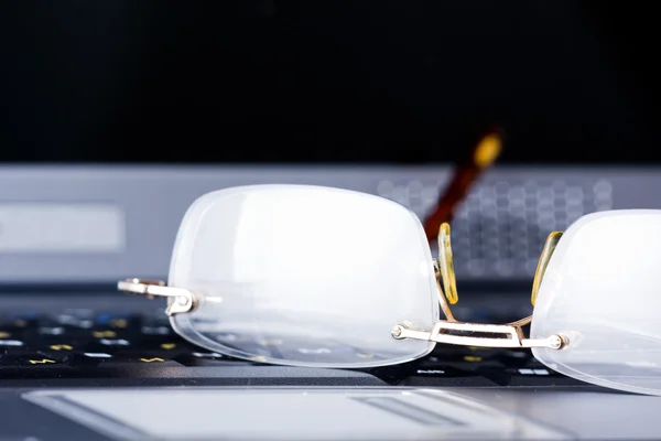 stock image Glasses lay on the keyboard