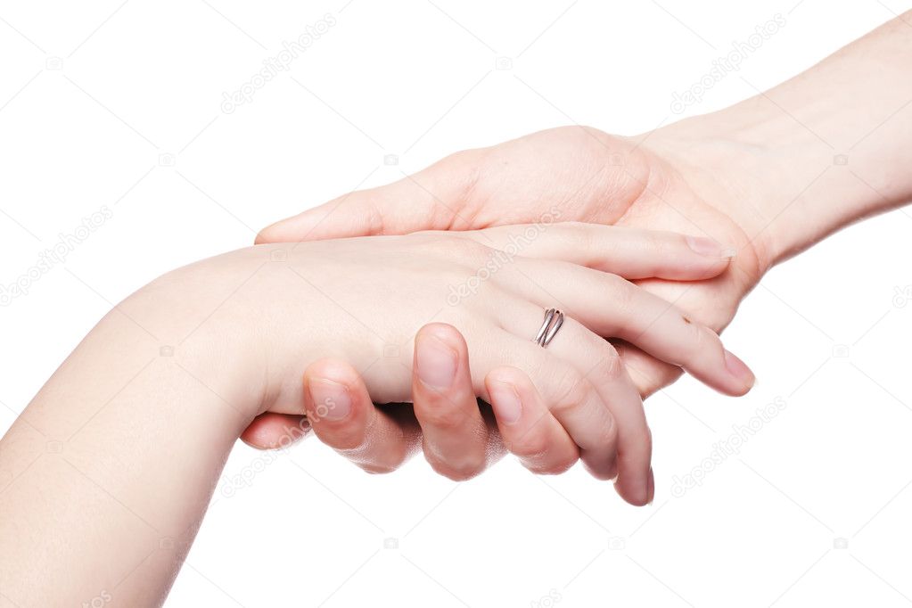The man gently holds a female hand