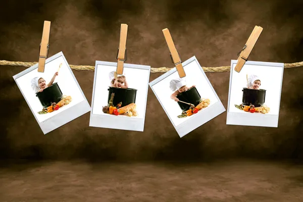 Chef-kok baby's op polaroid film opknoping in — Stockfoto