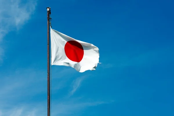 Japanese flag on blue sky