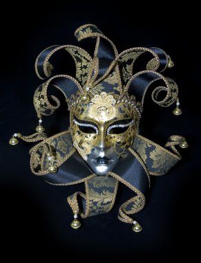 Venetian mask on black background clipart