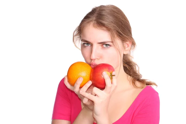 Flicka med äpple och apelsin — Stockfoto