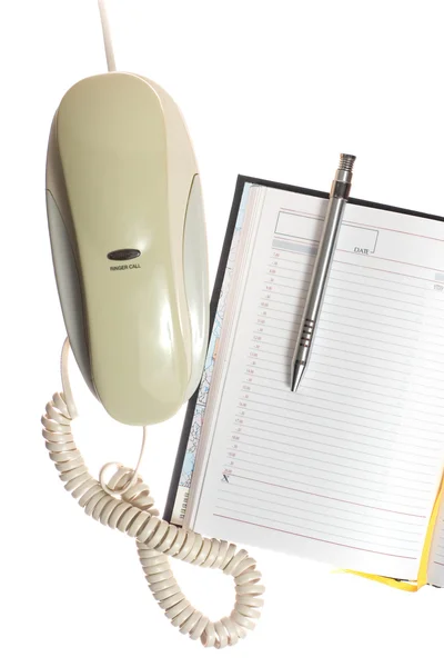 Telefon, Kalender und Stift Stockbild