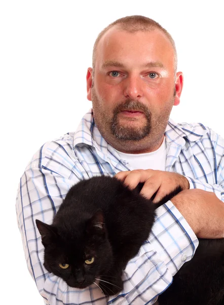 Man holds black cat in hands — Stock Photo, Image