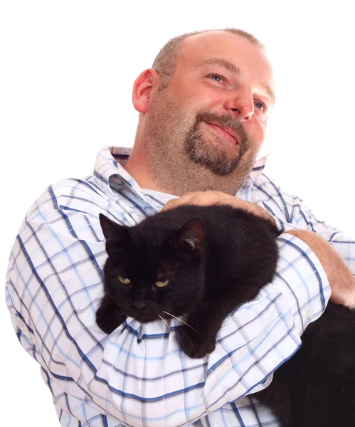 Man holds black cat in hands — Stock Photo, Image
