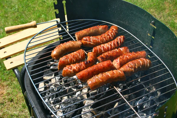 Sausages on a barbecue — Stock Photo, Image