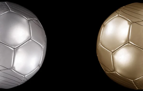Close up of a gold and silver footballs — Stock Photo, Image
