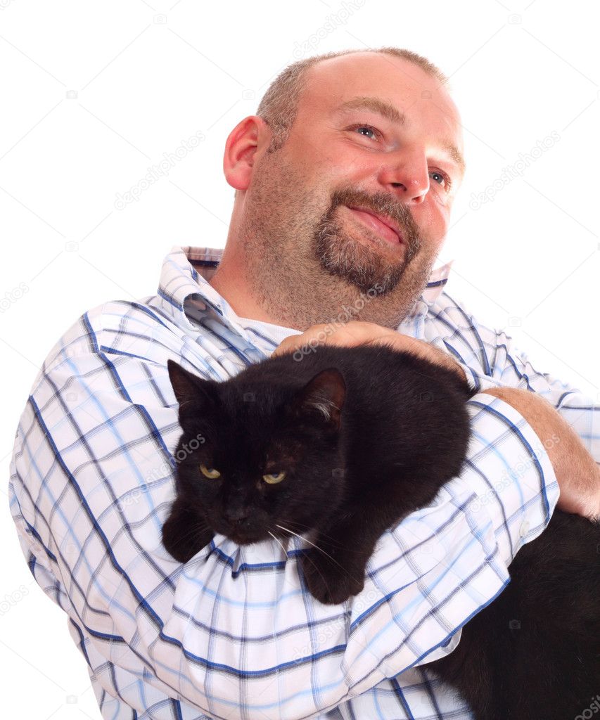 Man holds black cat in hands