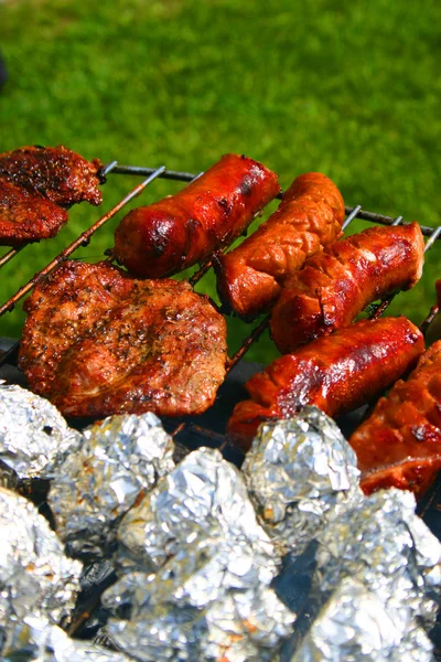 Sausages on a barbecue — Stock Photo, Image