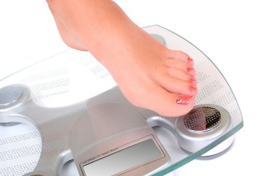 Foot on a bathroom scale clipart