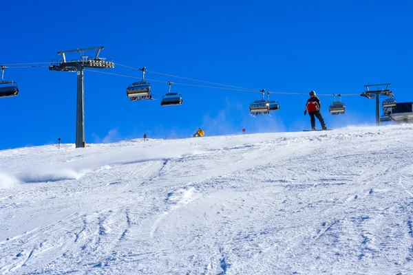 Ski slope covered mountain side — Stock Photo, Image