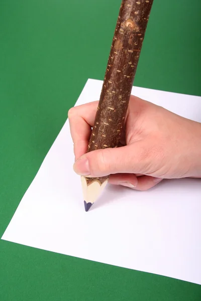 Hand with wooden pencil — Stock Photo, Image