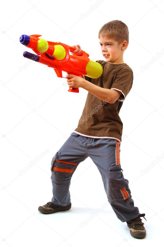 Young boy with water gun
