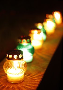 Closeup of votive candles clipart