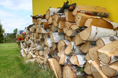 Stacked winter logs for heating clipart