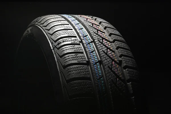 Nové auto pneumatiky zblízka — Stock fotografie