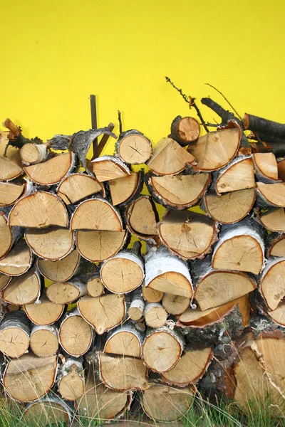Stacked winter logs for heating — Stock Photo, Image