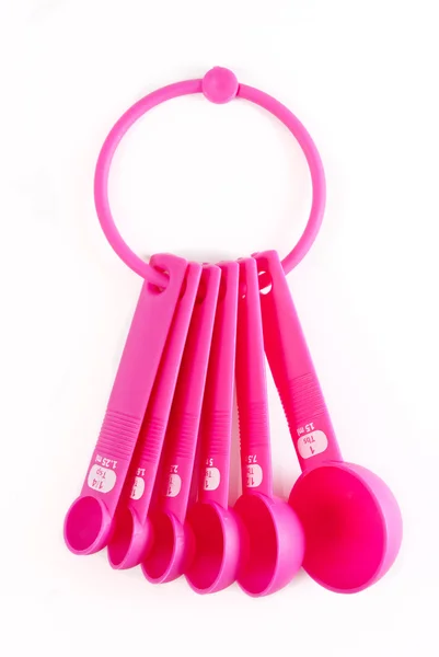Pink plastic baking utensils — Stock Photo, Image
