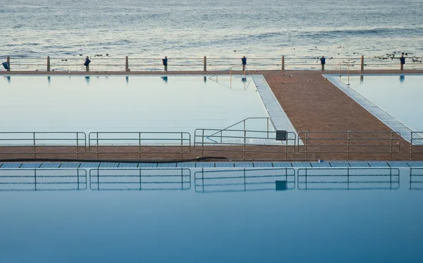 stock image Reflective pool and sea