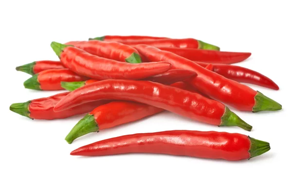 Chiles rojos picantes aislados en blanco —  Fotos de Stock