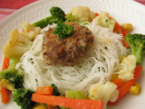 Rice pasta with vegetables and meatball — Stock Photo, Image